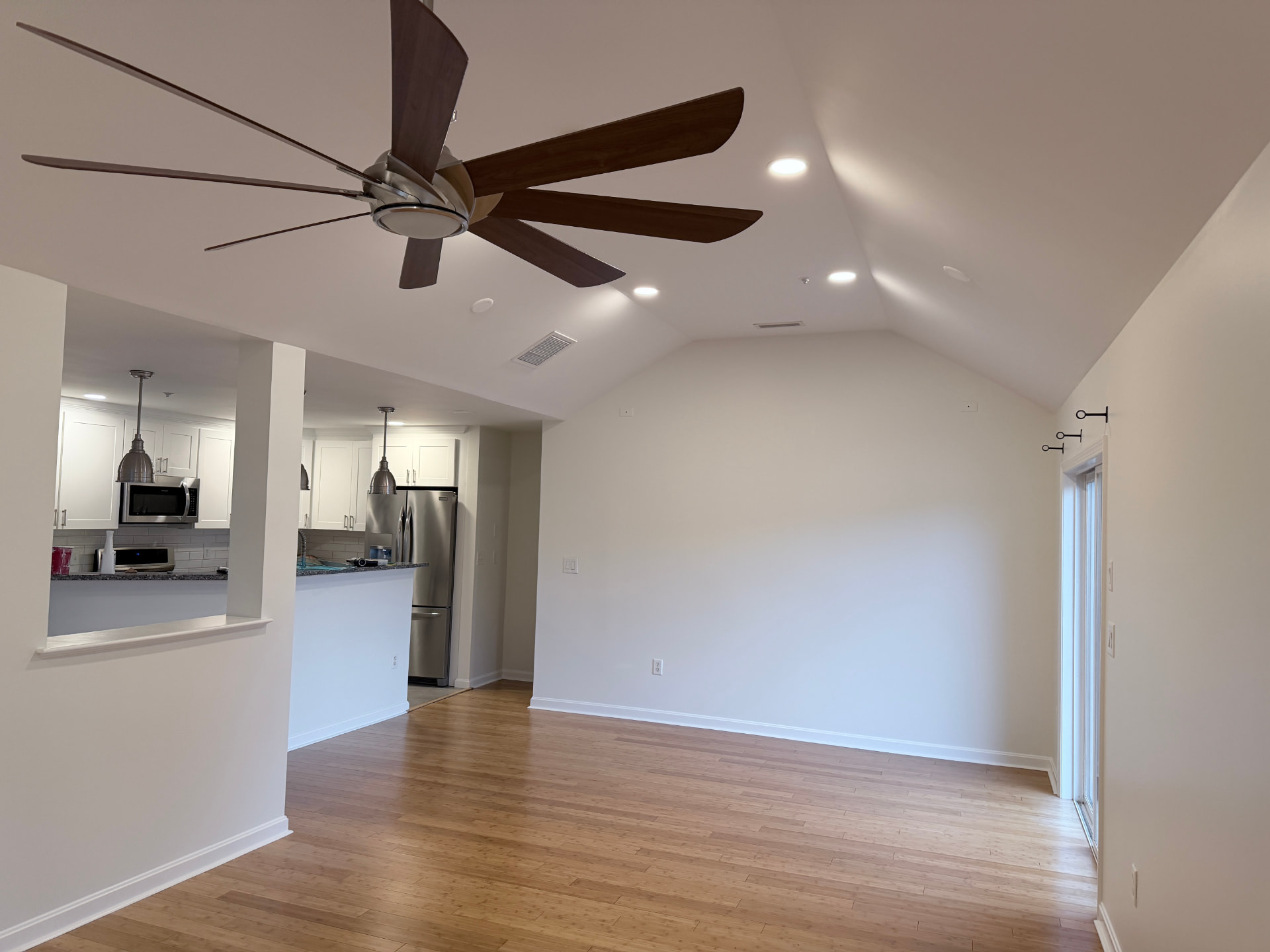 Newly painted great room opening to the kitchen